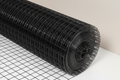 Black wire mesh with warm gray background